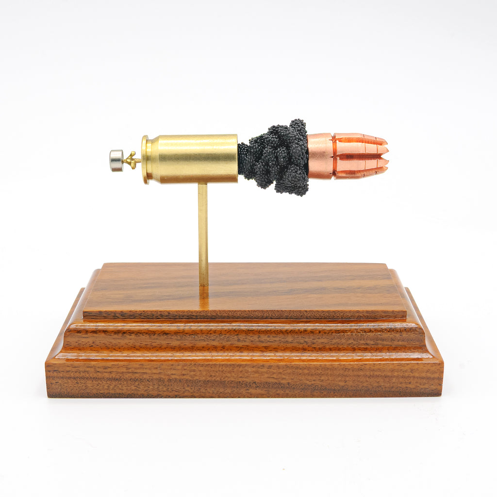 45 Auto R.I.P. G2 Research expanded cartridge anatomy display on hardwood base