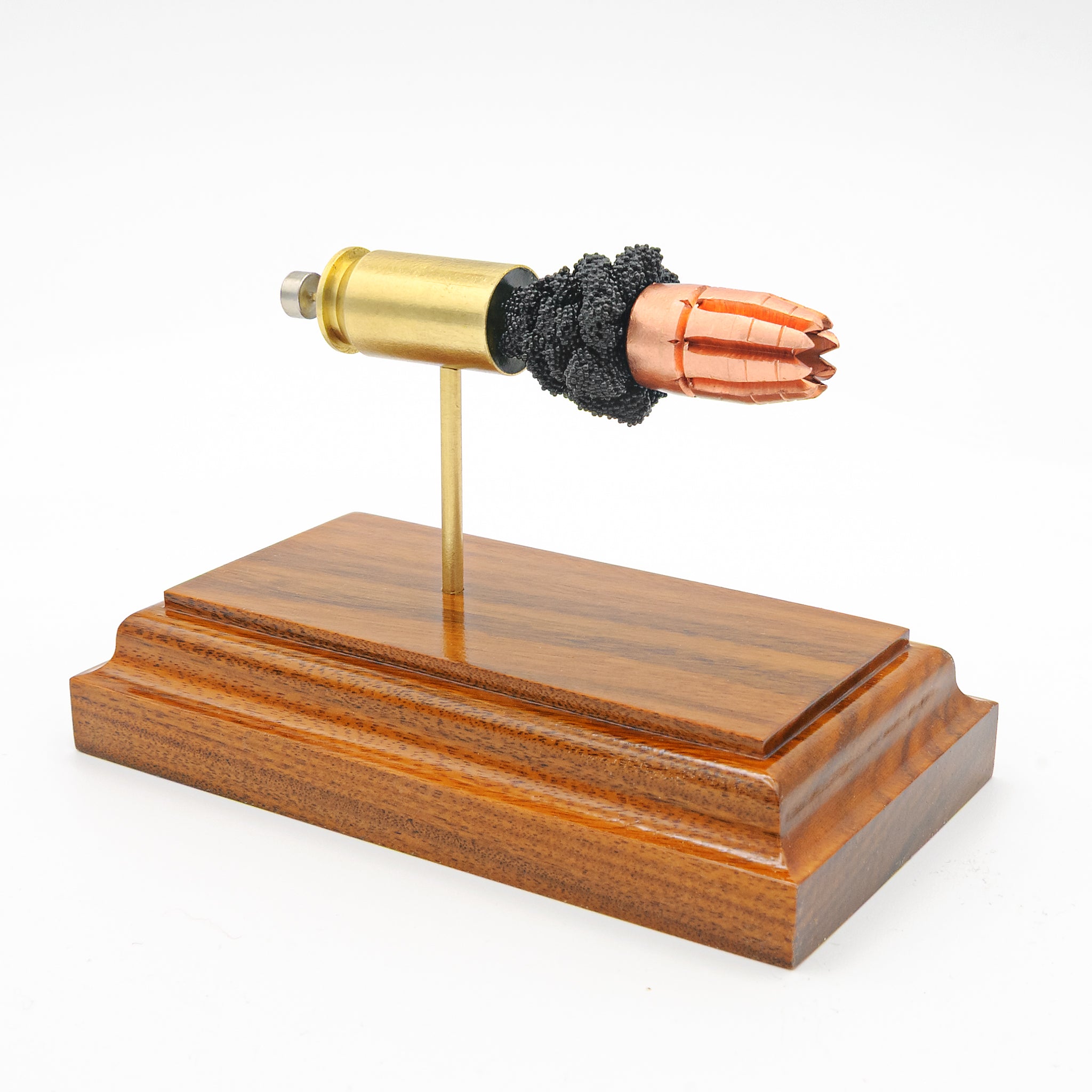 Exploded 45 ACP R.I.P. G2 round showing primer, case, powder, and projectile desk decor