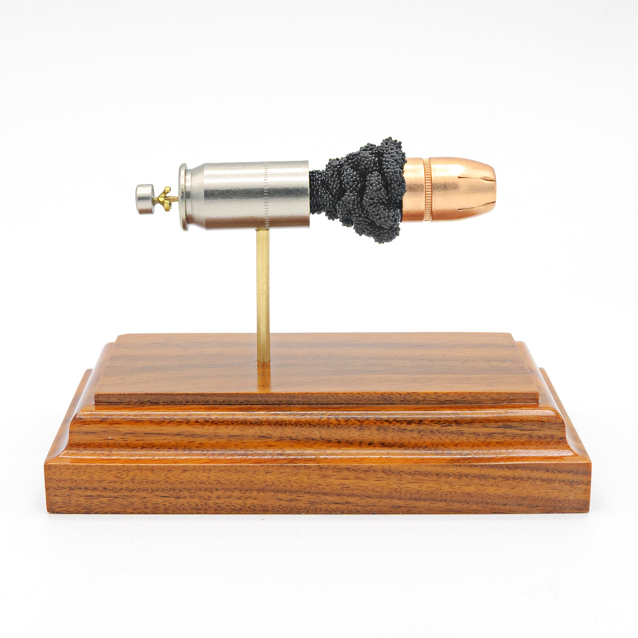45 Auto +P Federal 230gr HST JHP expanded cartridge display model on hardwood base