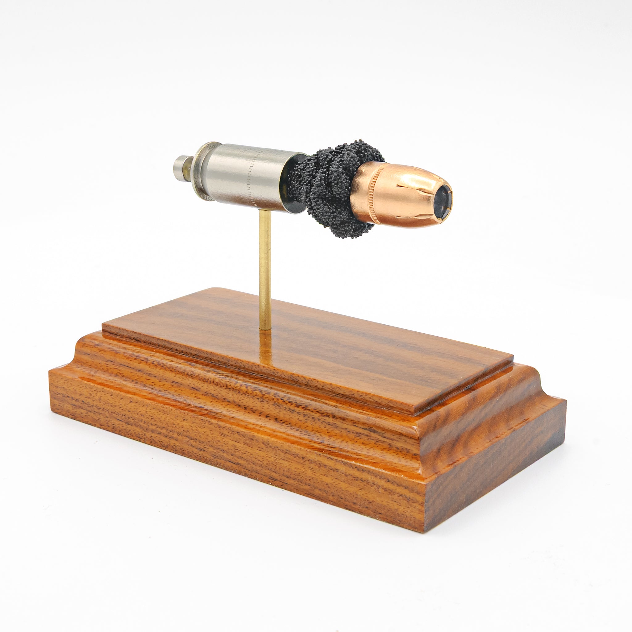 Sectioned 45 Auto +P Federal HST cartridge showing primer case powder and JHP bullet aligned horizontally