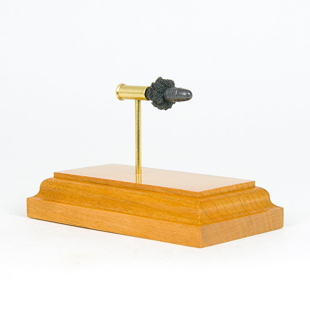 Expanded 22LR SK Ammo Rifle Match cartridge display on cherry wood base