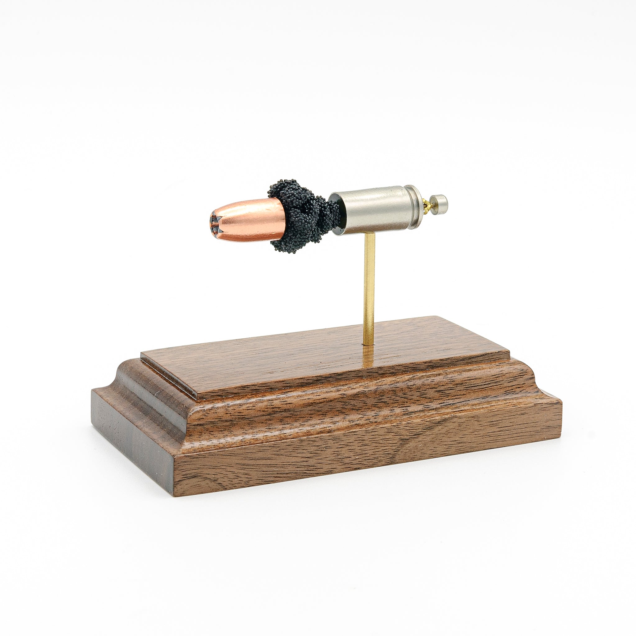 Front angled view of 9mm Speer Gold Dot hollow point bullet in exploded cartridge display