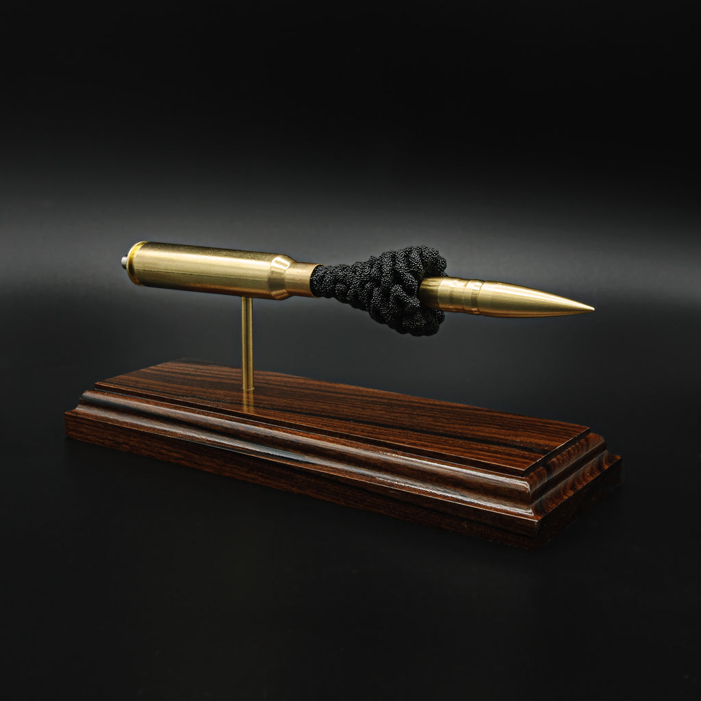 inert 408 cheytac cartridge display on hardwood base