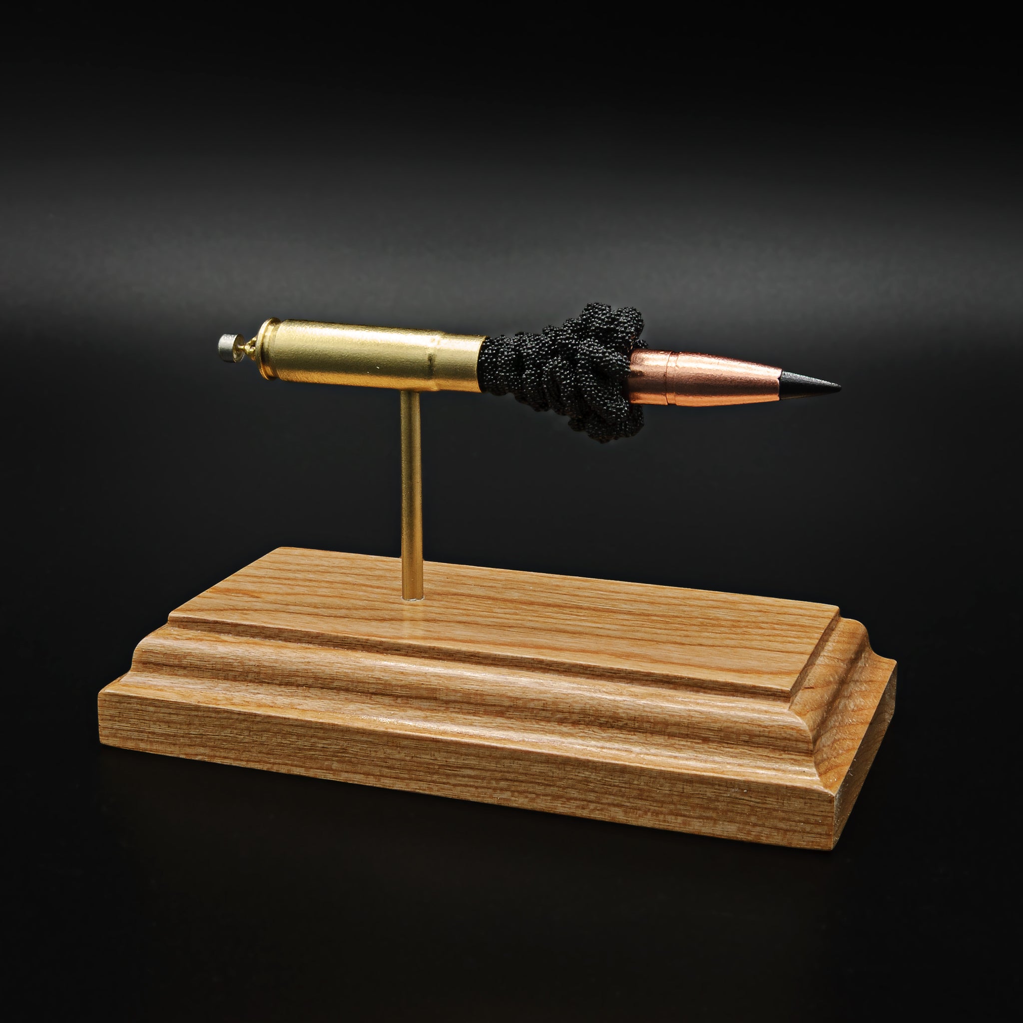Expanded 300 Blackout Barnes Vor-TX cartridge display on hardwood base