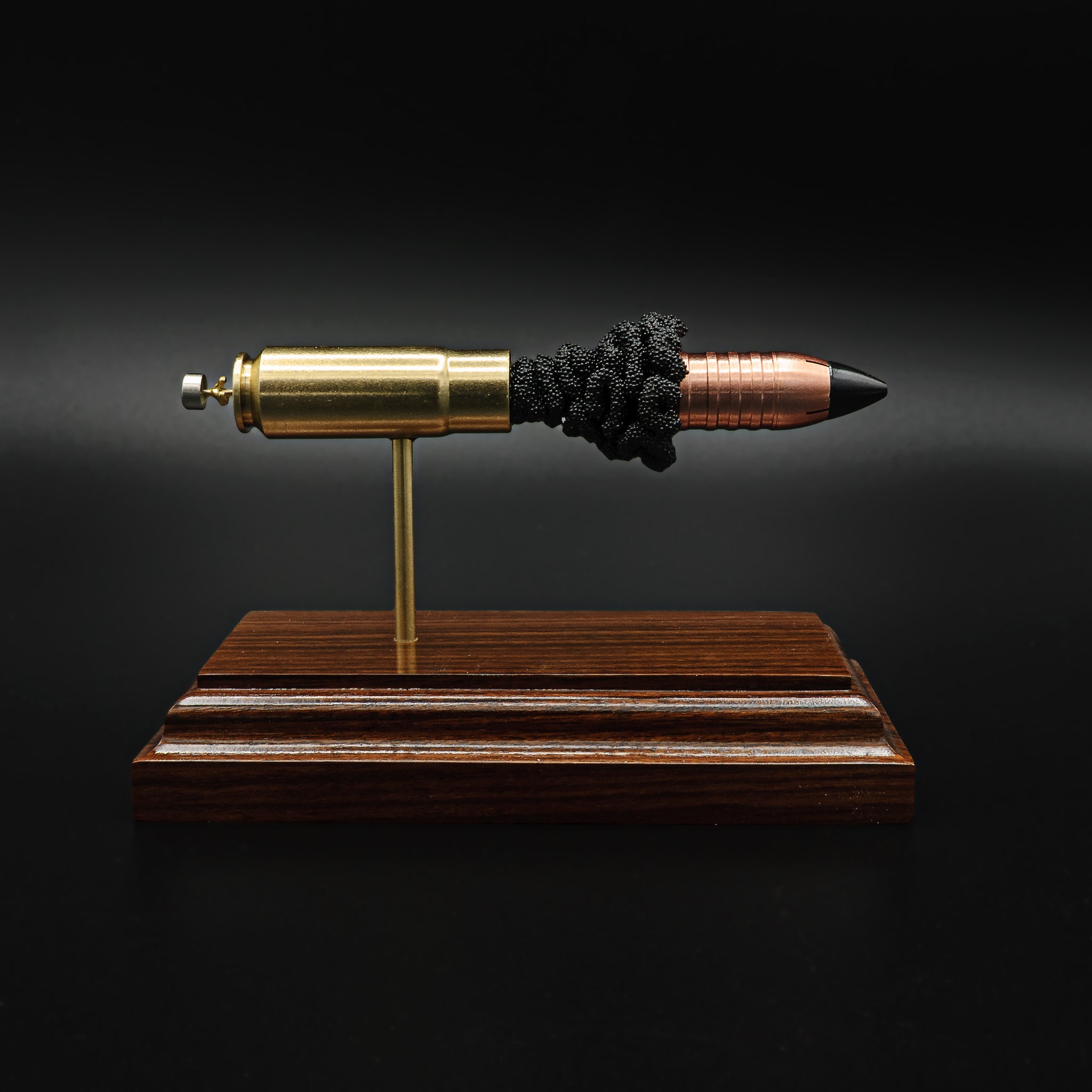 458 SOCOM 265gr Flat Base Raptor Cutting Edge Bullets expanded cartridge display model on Bolivian Rosewood base