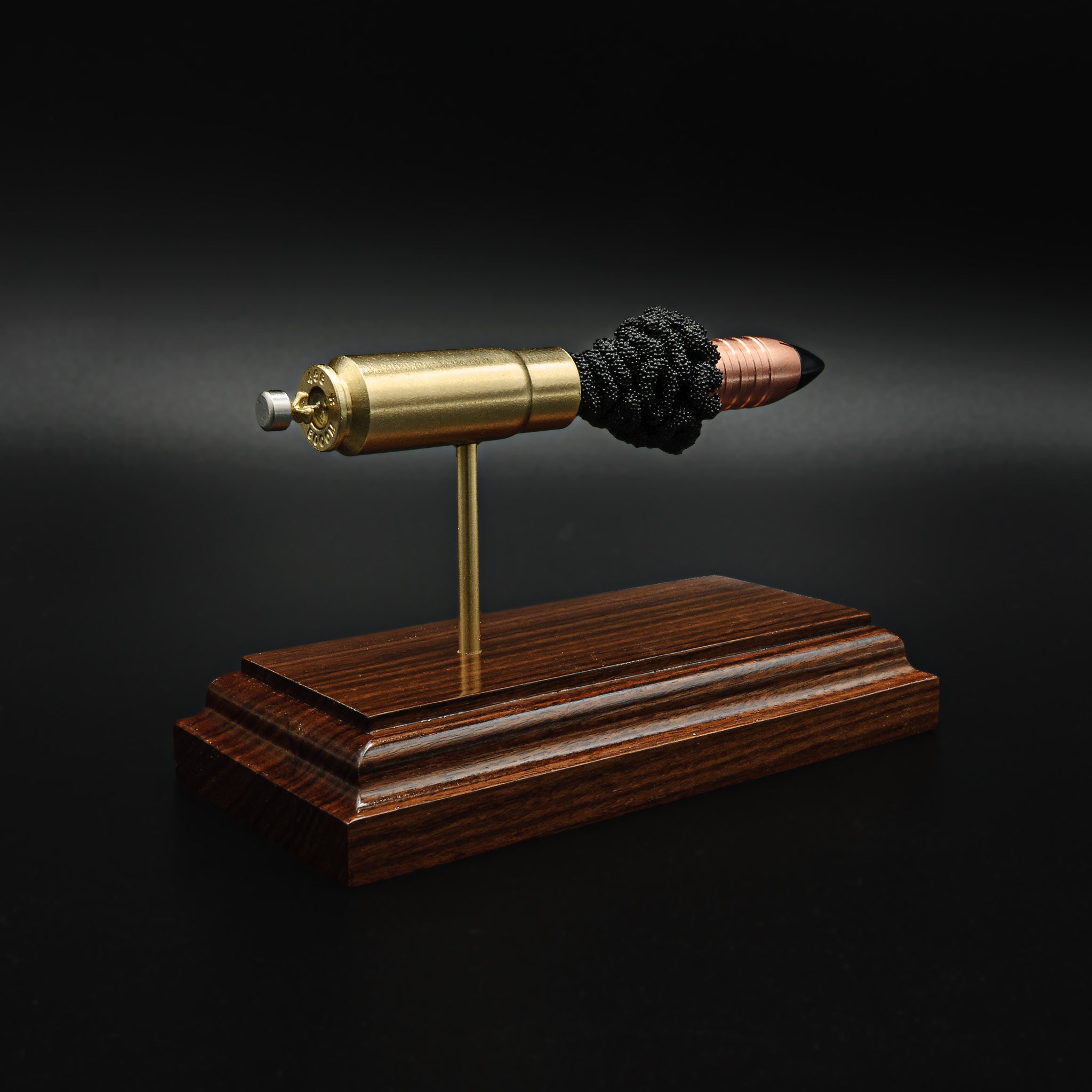 458 SOCOM anatomy cartridge display mounted on solid hardwood base