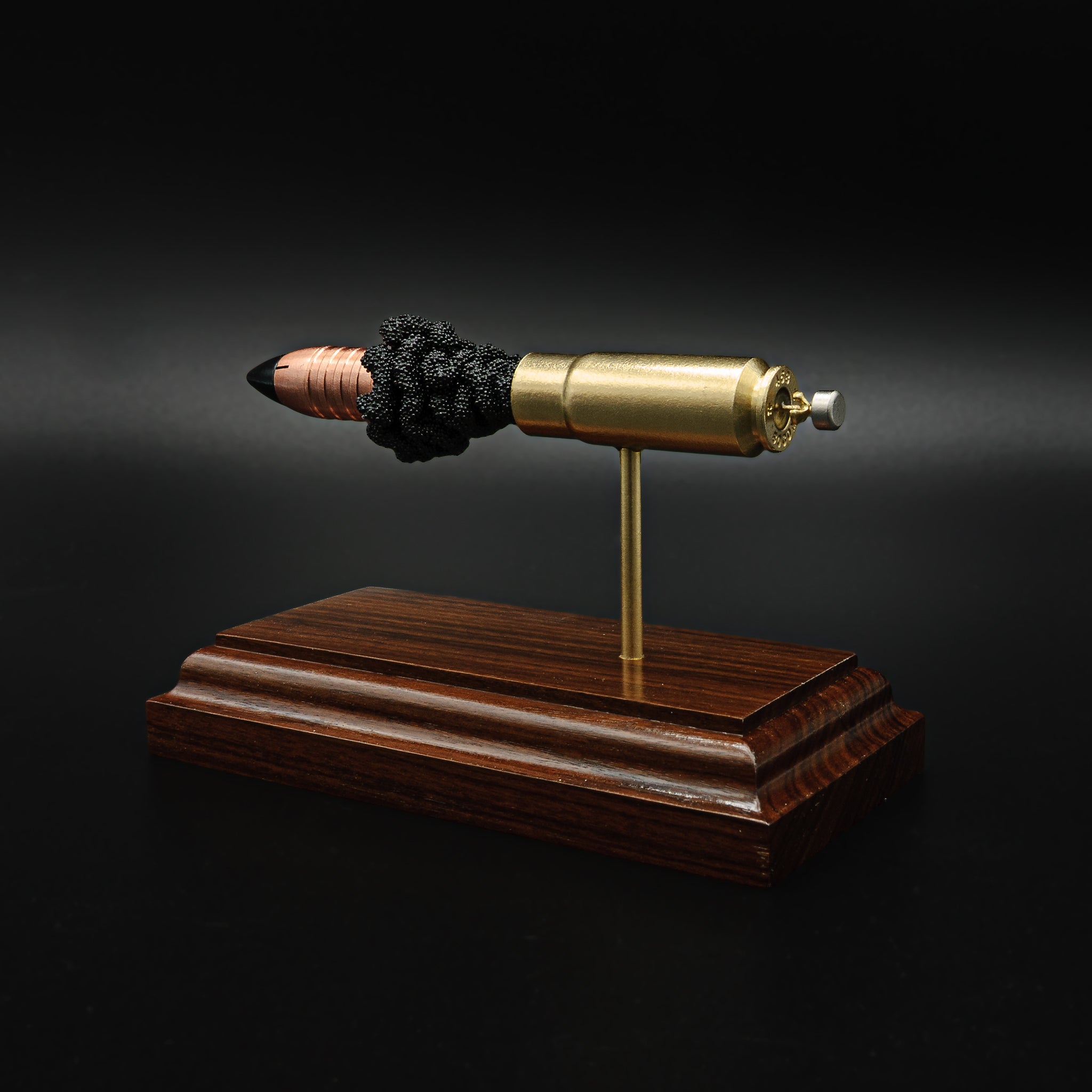 458 SOCOM cutaway cartridge display mounted on solid hardwood base