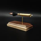 Rear view of a .30-06 Springfield Hornady Precision Hunter 178gr ELD-X cartridge anatomy display showing the cartridge case head, primer cup, anvil, simulated powder, and projectile on a hardwood base.