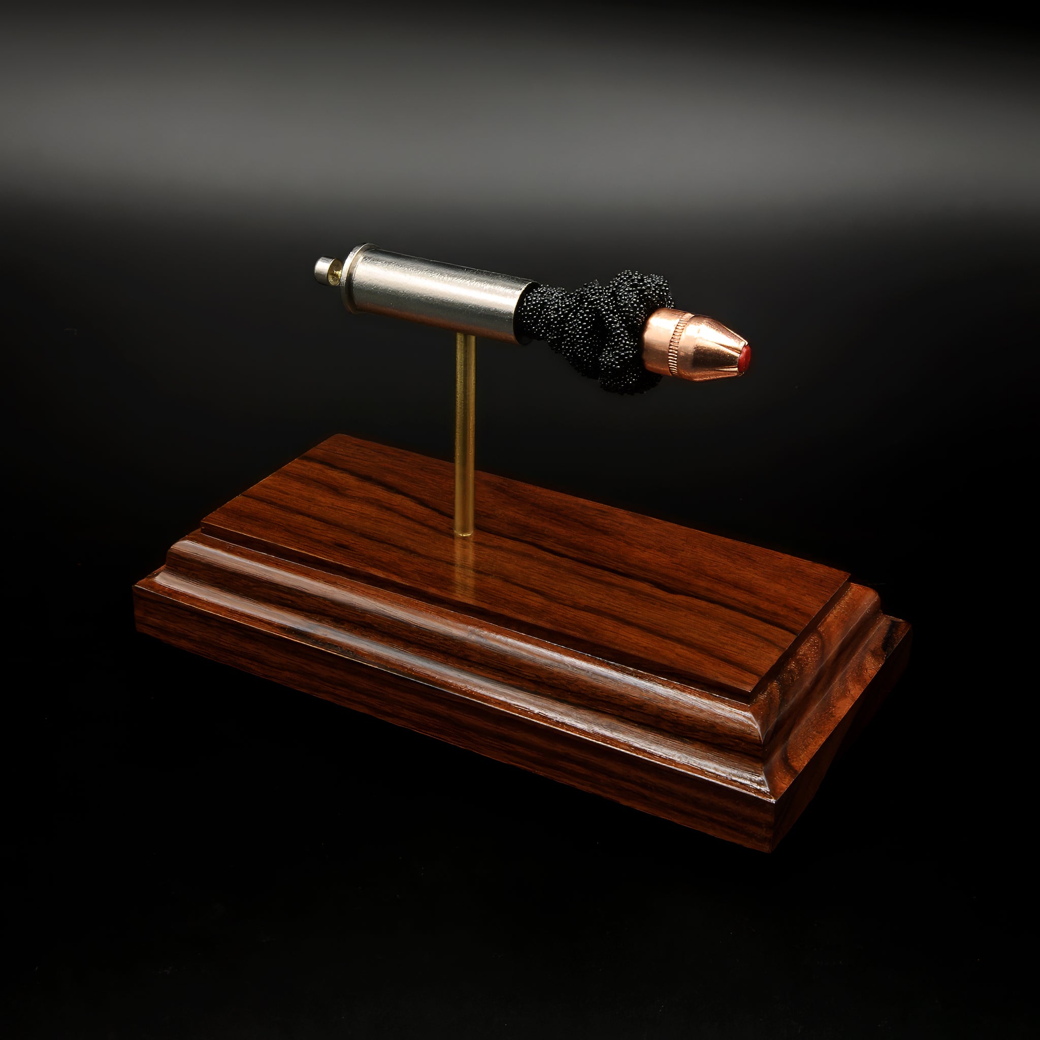 decorative ballistic display for gun enthusiasts showing separated cartridge components