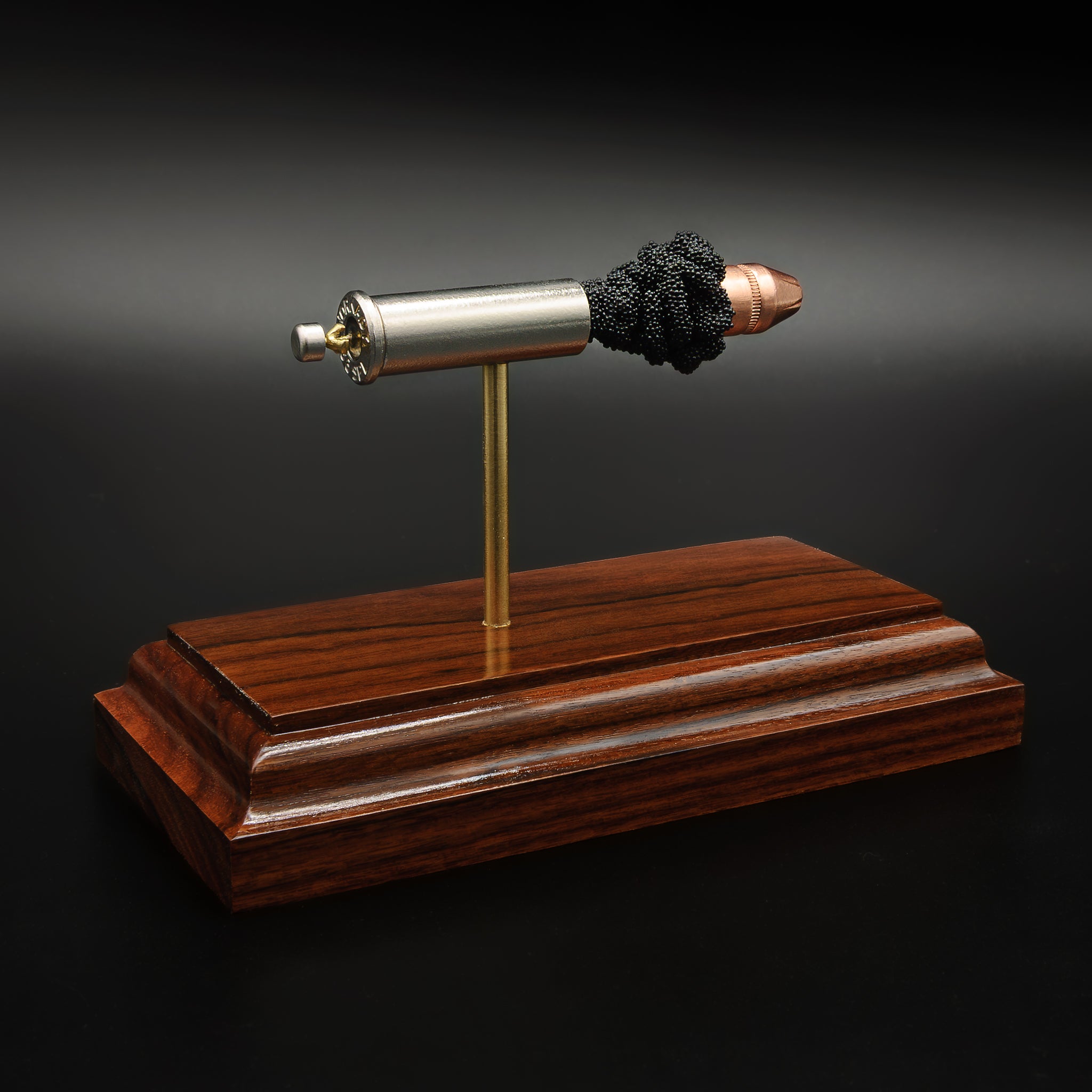 Hornady Critical Defense FTX 38 Special exploded ammunition display model mounted on Bolivian rosewood