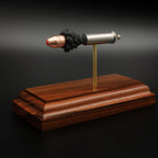 ballistic cartridge component display model with Hornady FTX defensive bullet on hardwood stand