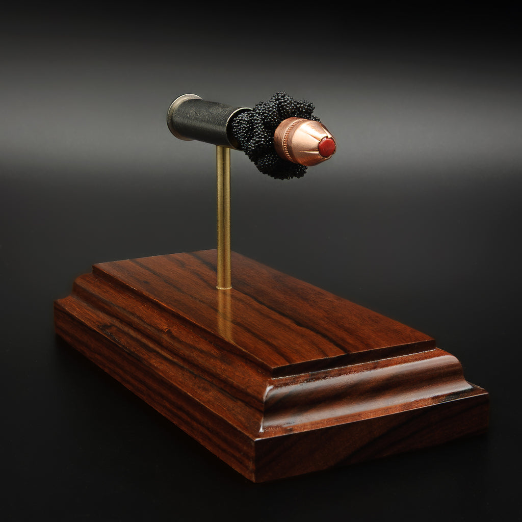 precision ammunition anatomy model mounted on handcrafted Bolivian rosewood collector base
