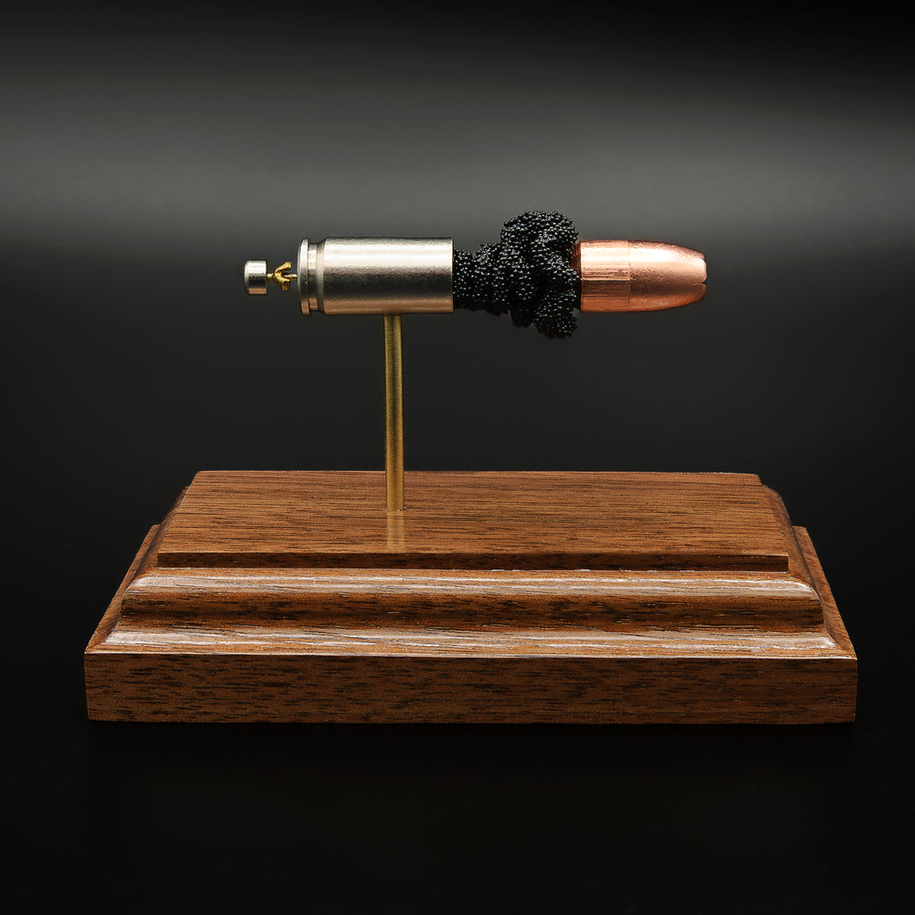 collector ammunition display featuring Speer Gold Dot hollow point bullet with exposed powder charge and components