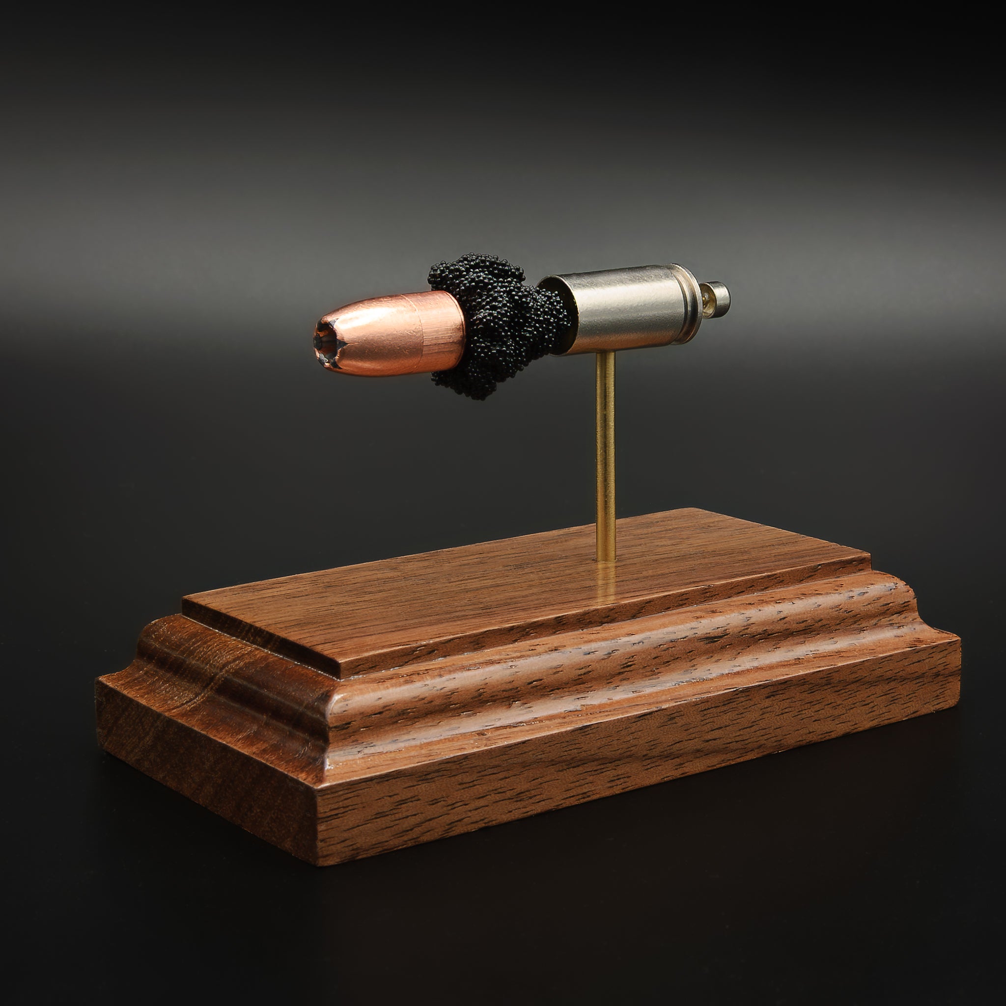 Handmade 9mm luger training educational display on hardwood base. Features the 9mm luger gold dot in exploded view to show all the internal components.