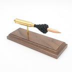Expanded 338 Lapua Magnum cartridge display on hardwood base
