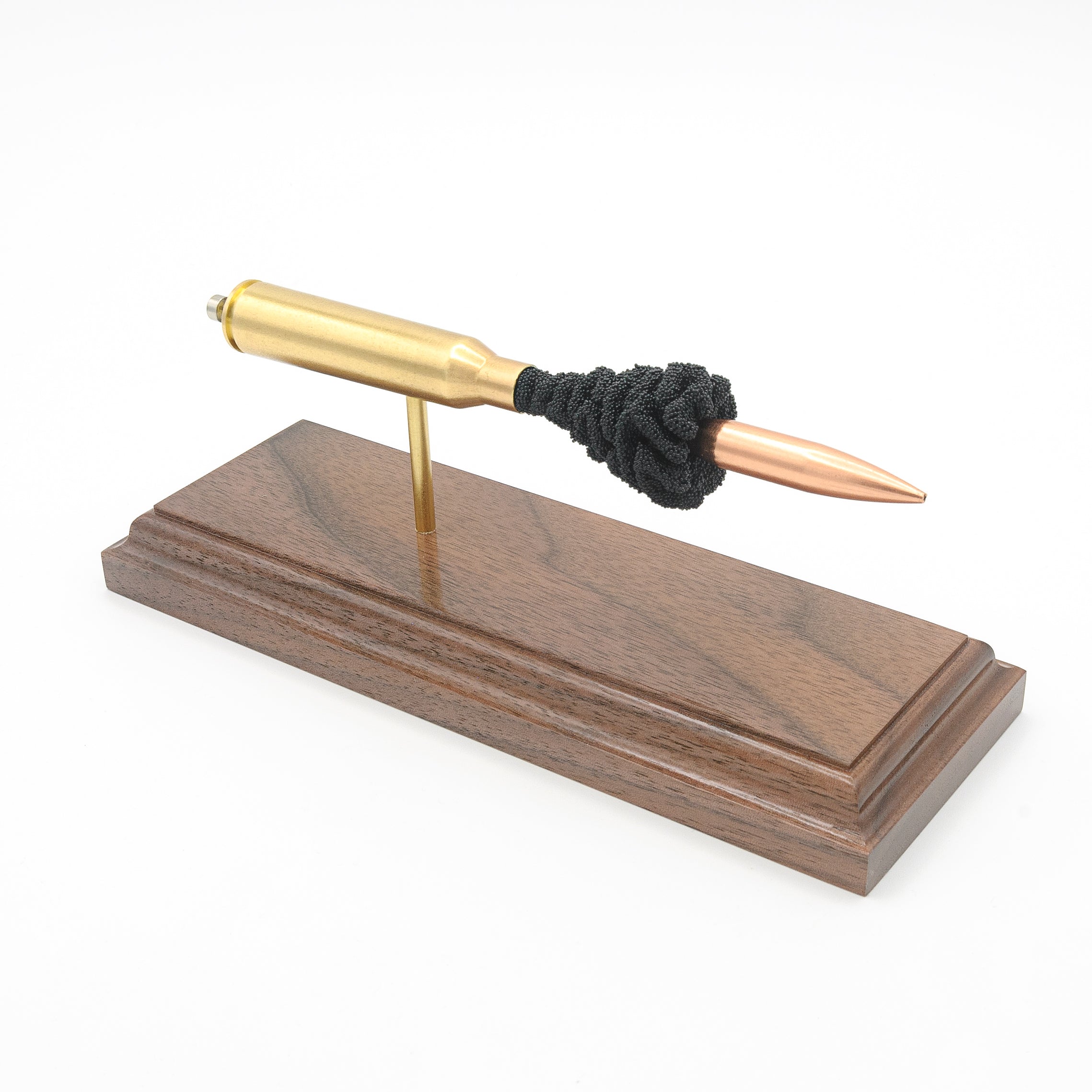 Expanded 338 Lapua Magnum cartridge display on hardwood base