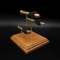 Elevated angled view of the 45-70 Government, 30-30 Winchester and 45 Colt exploded cartridge display on a square cherry hardwood base.