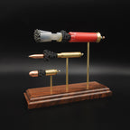 End view of the Heavy Metal 3-Gun cartridge display highlighting the 12 gauge shotshell base and the case heads of the 308 Winchester and 45 Auto.