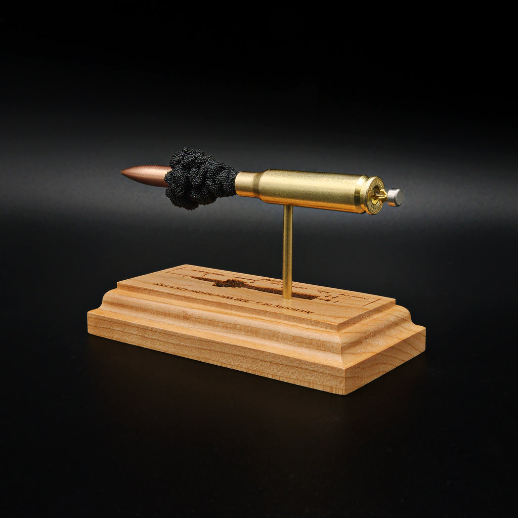 Rear angle of a handcrafted .308 Winchester anatomy display showing the brass case, primer assembly, and 168gr Sierra MatchKing HPBT bullet mounted above an engraved cartridge anatomy diagram.