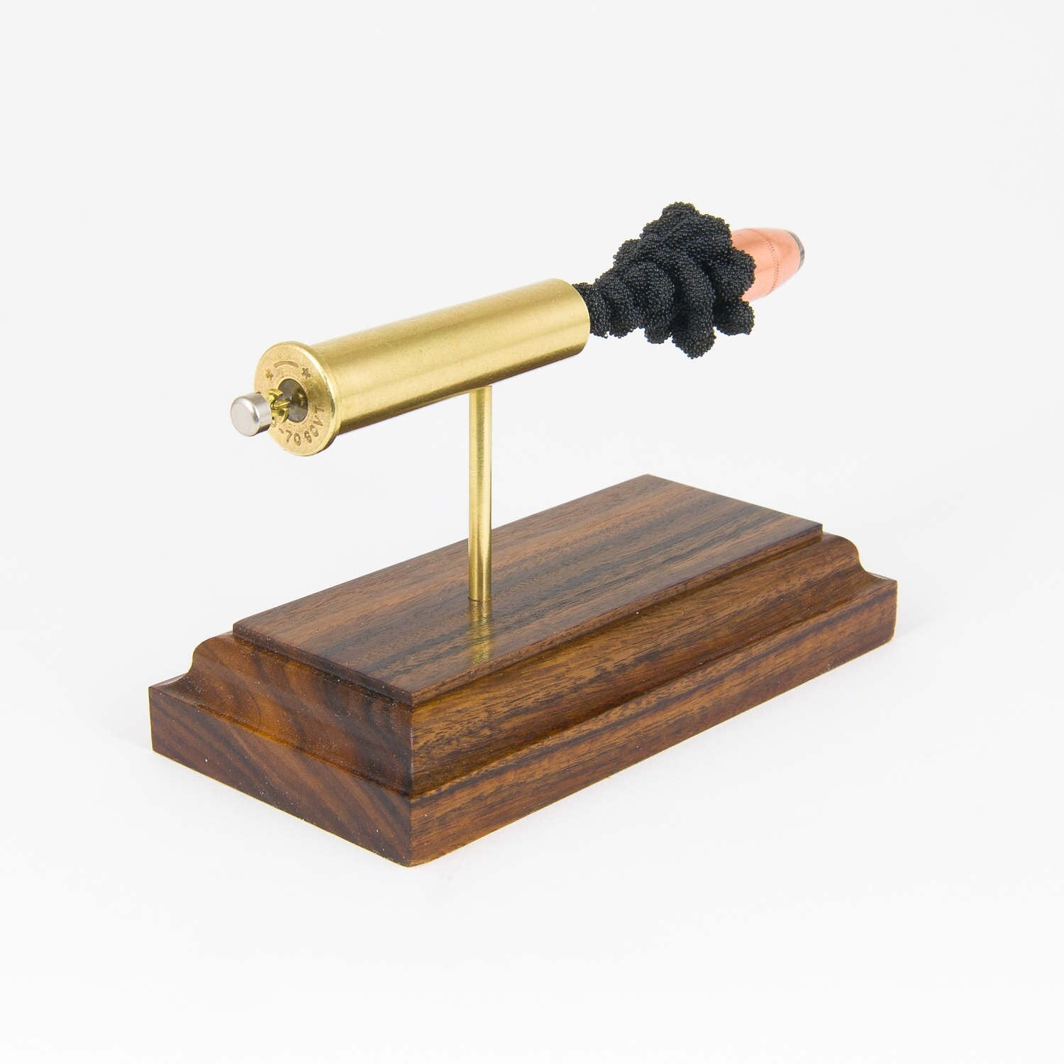 Sectioned 45-70 Government rifle cartridge showing primer case powder and hollow point bullet aligned horizontally