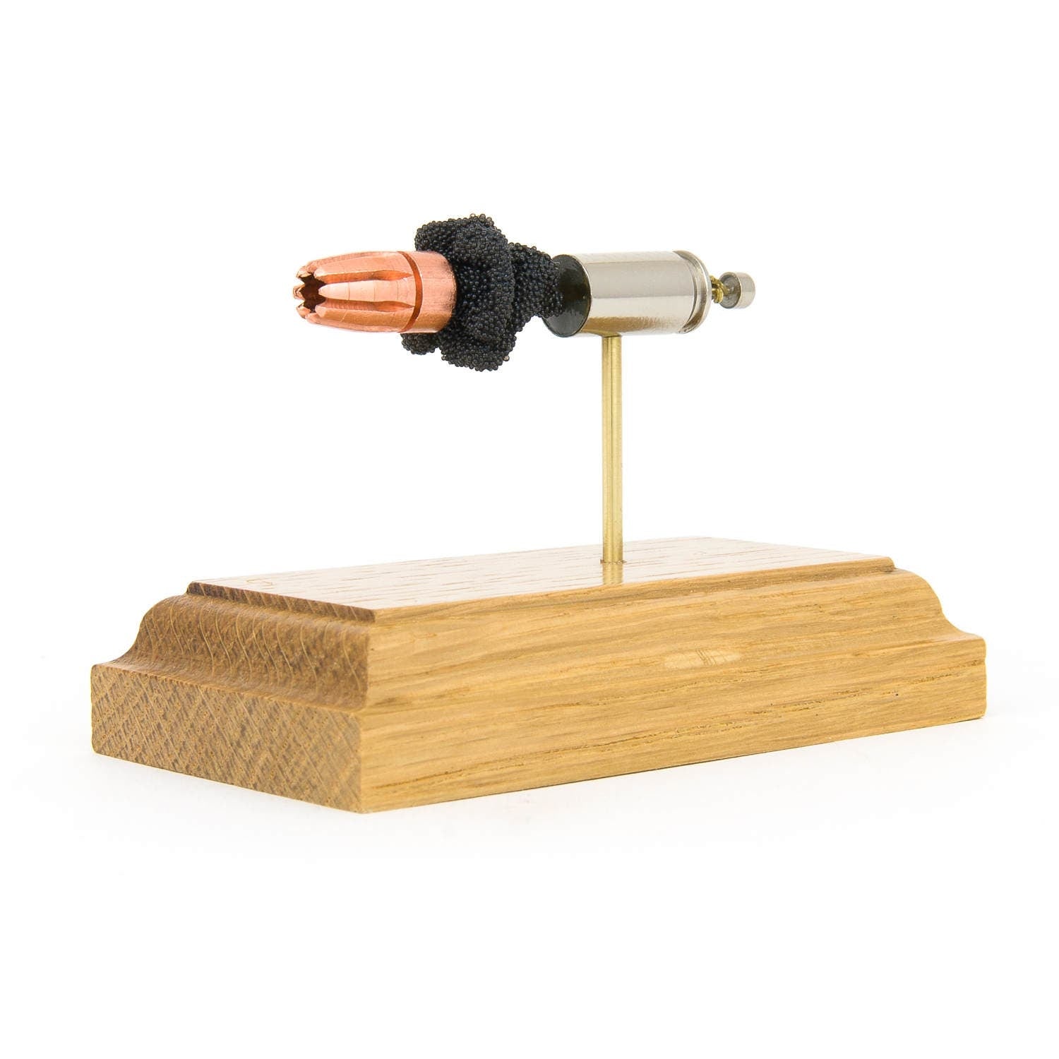 inert 9mm rip ammunition display on hardwood base