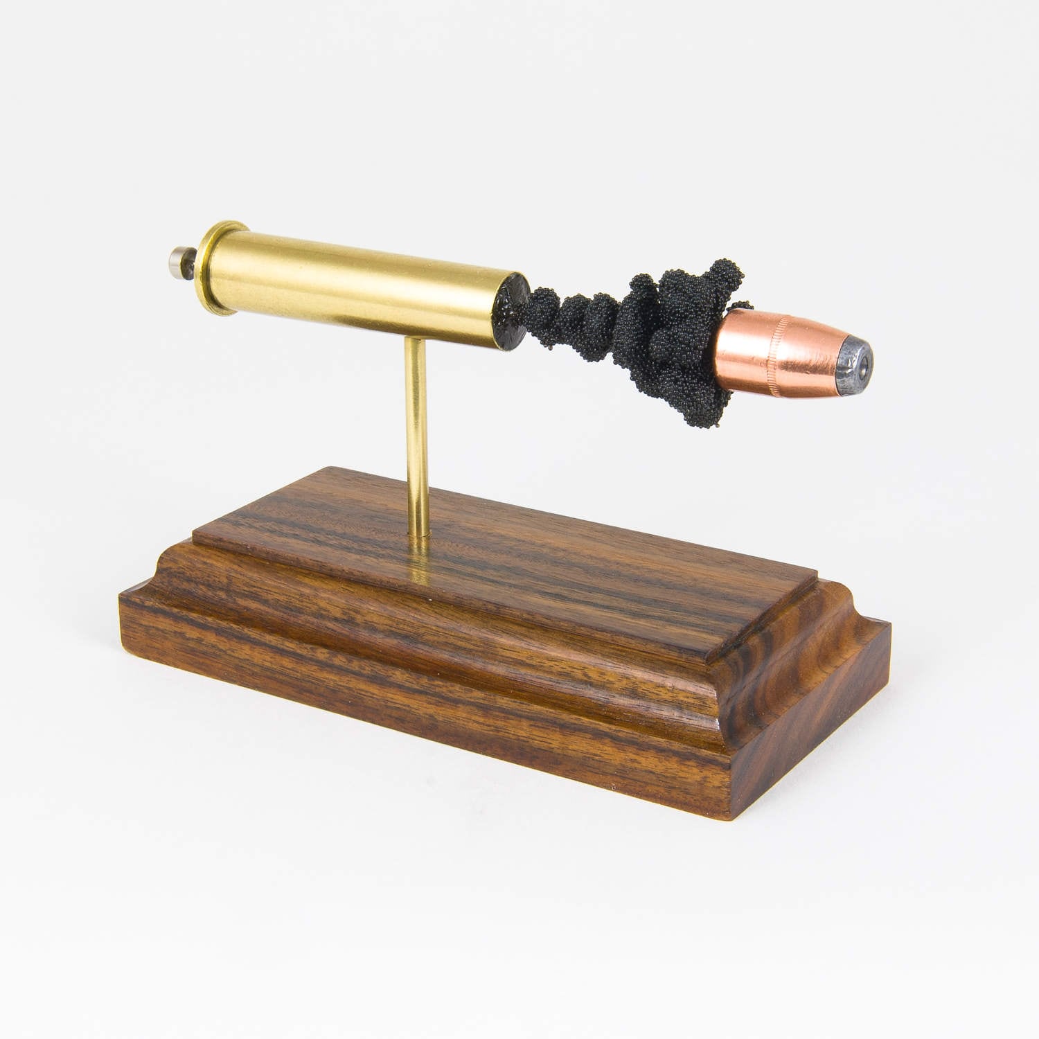 45-70 Government Hornady 300gr Hollow Point expanded cartridge display model on Bolivian Rosewood base