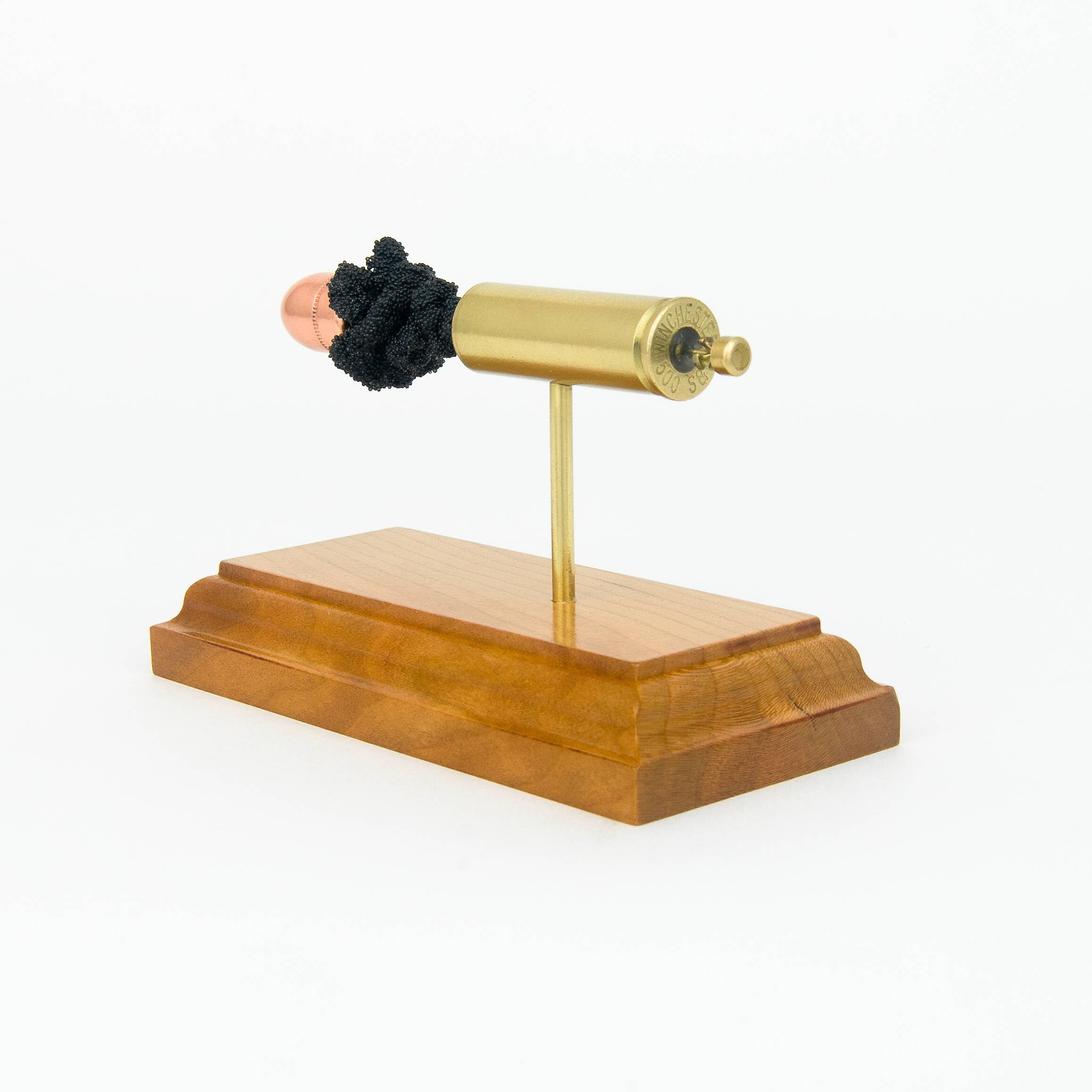 500 S&W Magnum cutaway cartridge display mounted on solid hardwood base