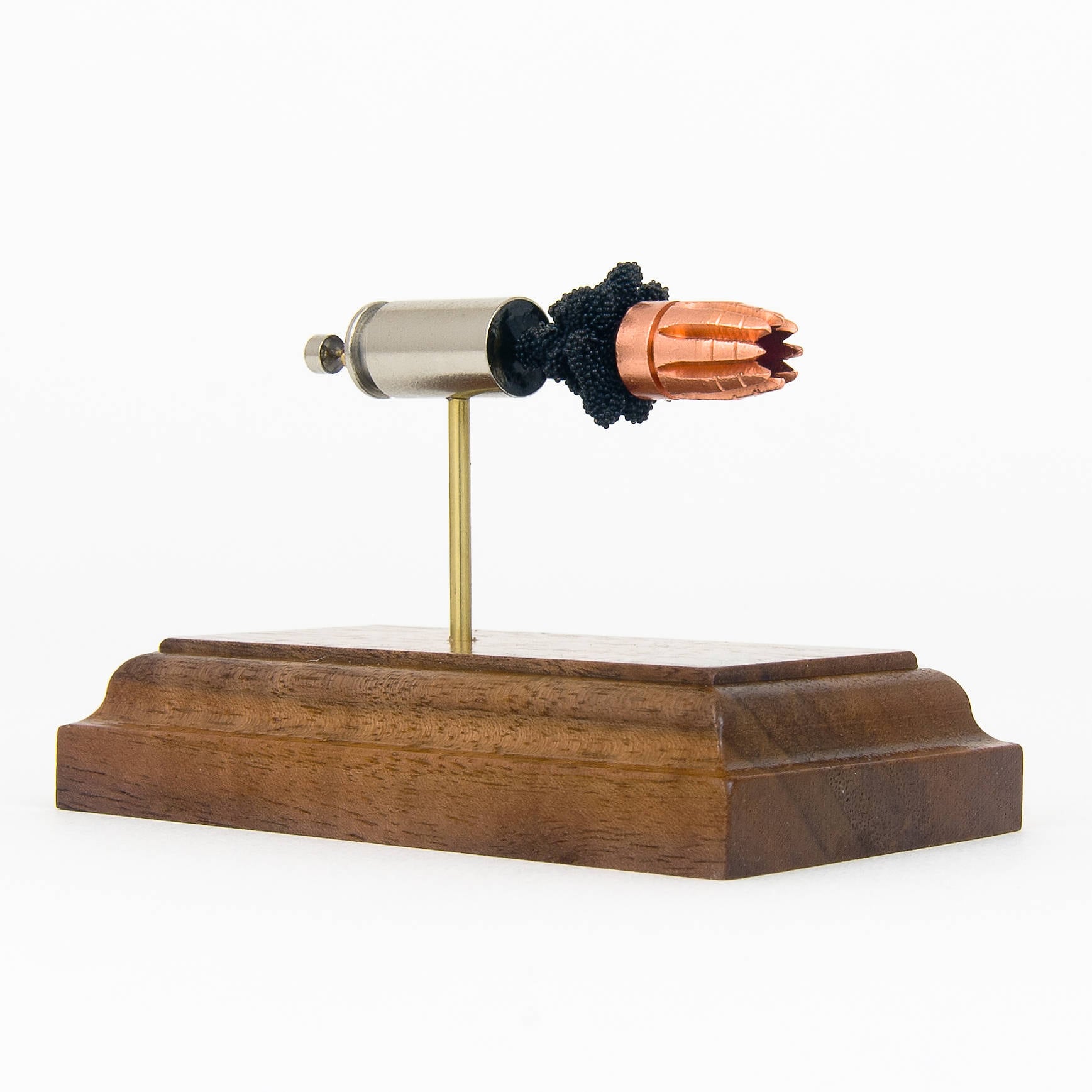 inert 40 s&w cartridge display on hardwood base