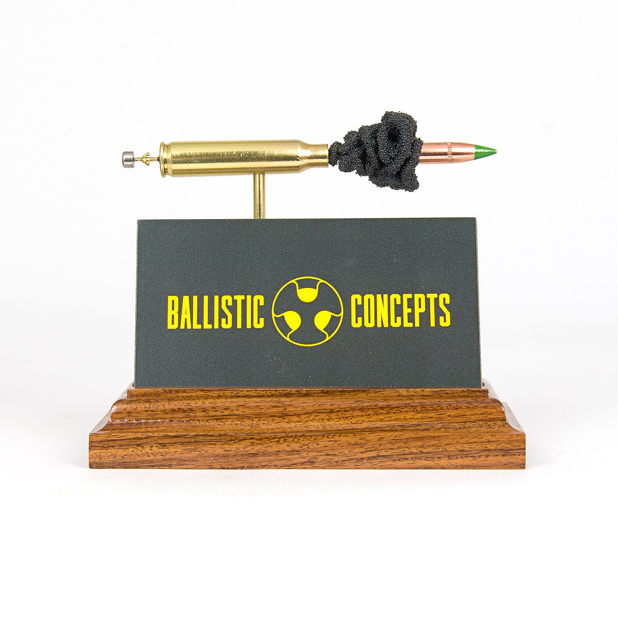 exploded cartridge business card holder on hardwood base