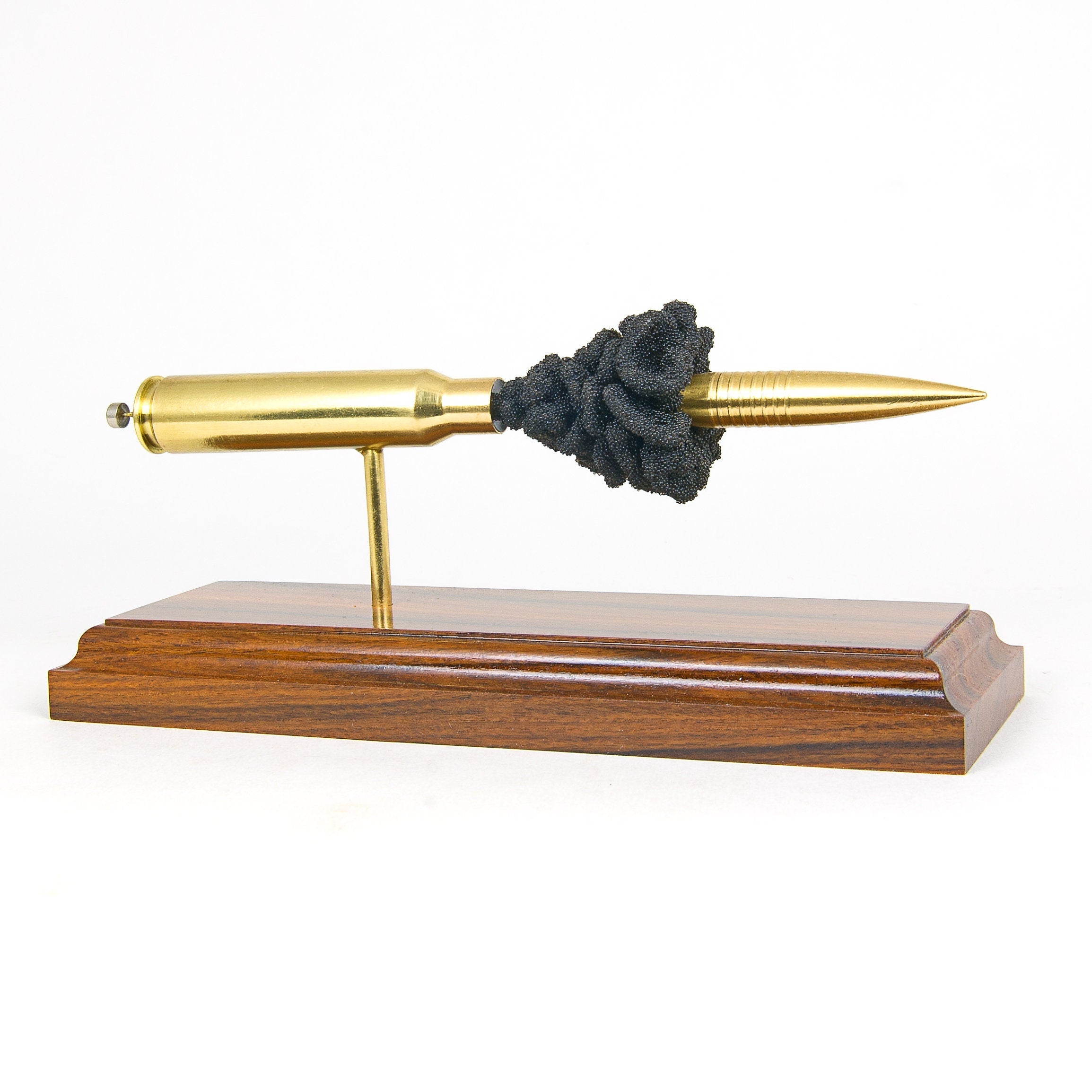 inert 408 cheytac cartridge display on hardwood base