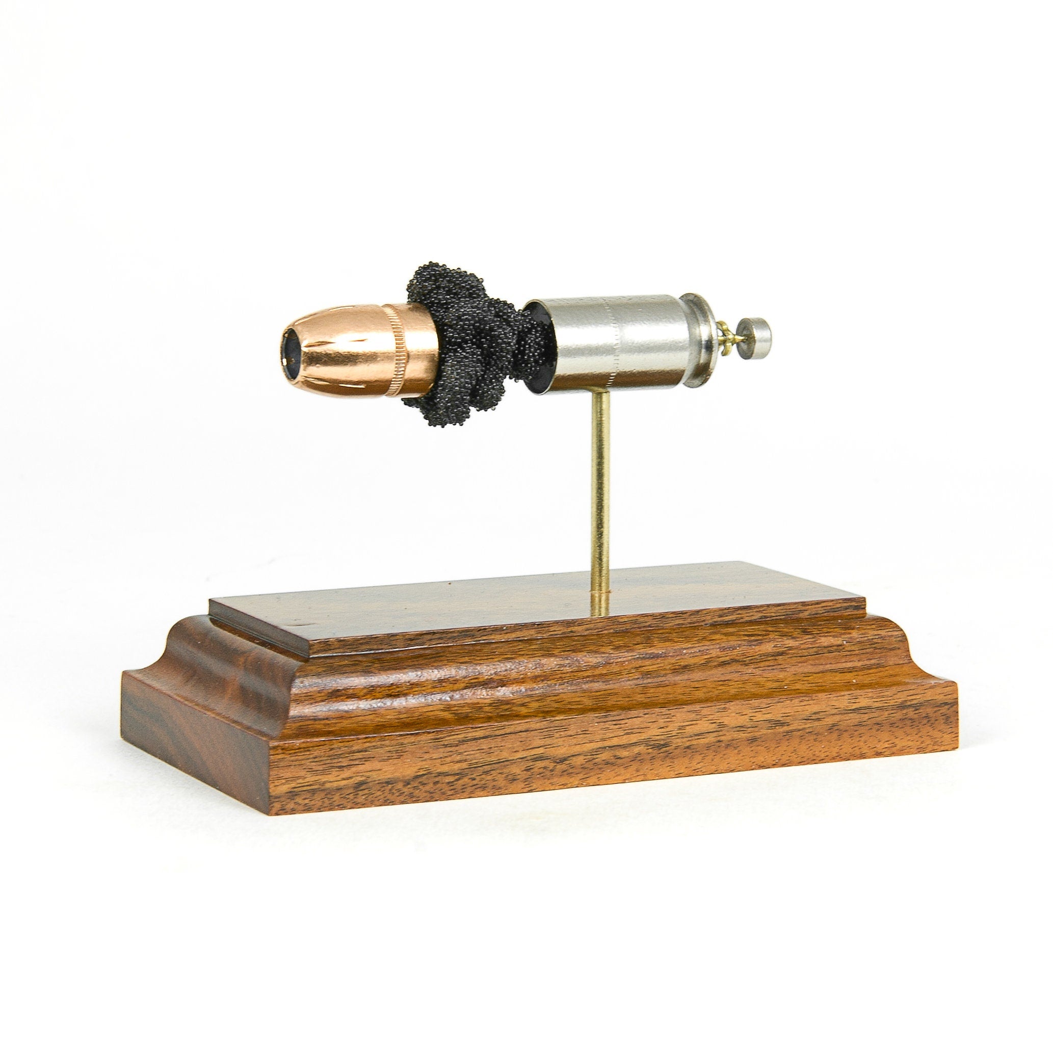 45 Auto +P HST cutaway cartridge display mounted on Bolivian Rosewood base