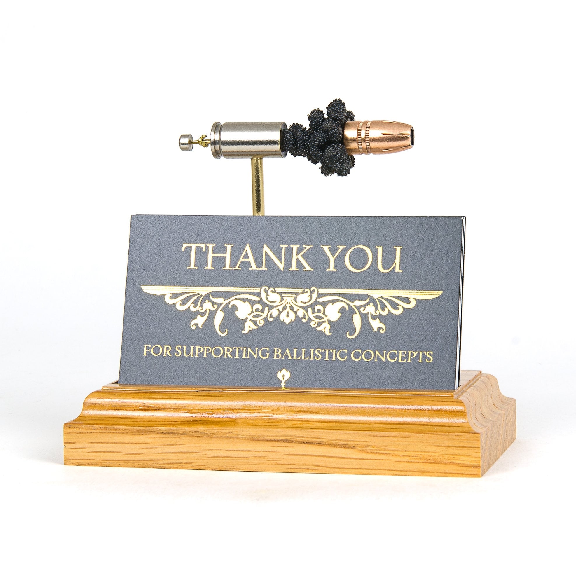 Pistol caliber business card holder expanded cartridge display on hardwood base
