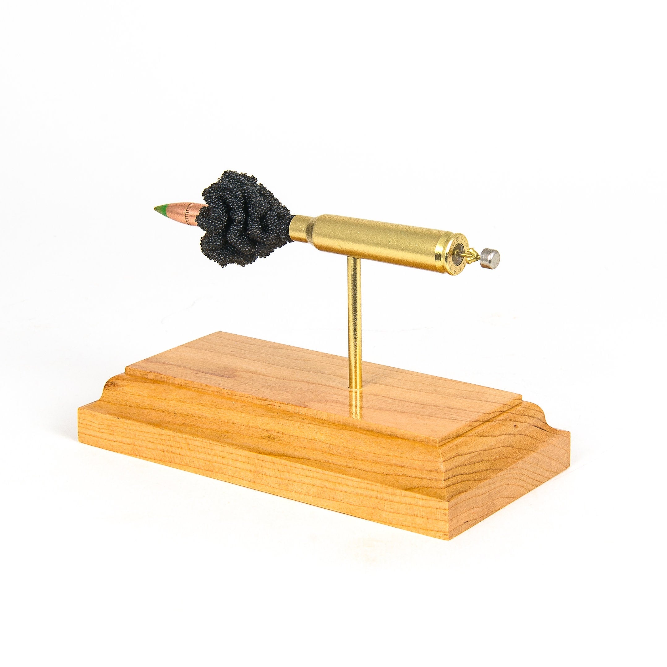 5.56x45mm M855 cutaway cartridge display mounted on solid hardwood base