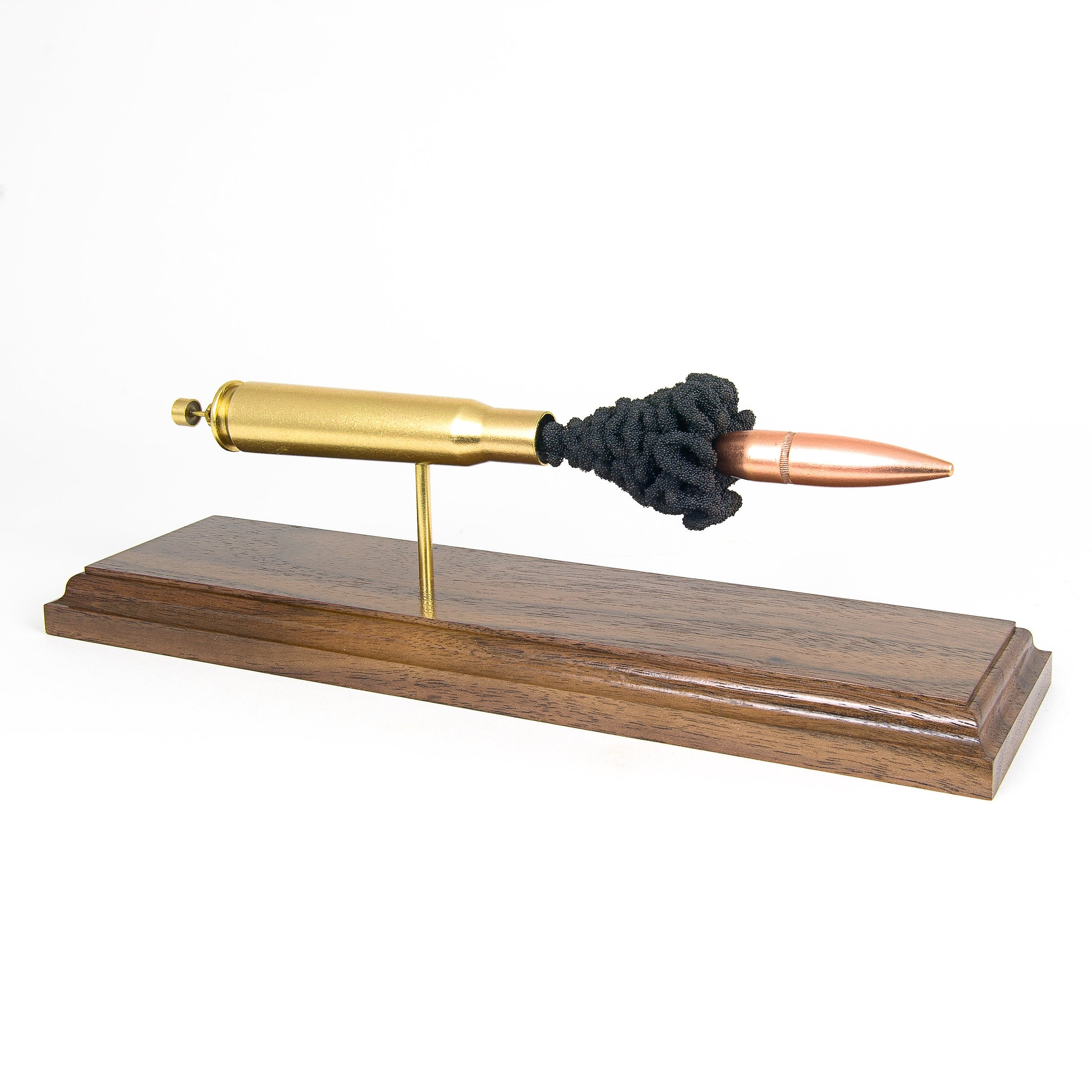 50 BMG expanded cartridge display model with FMJ bullet on walnut base