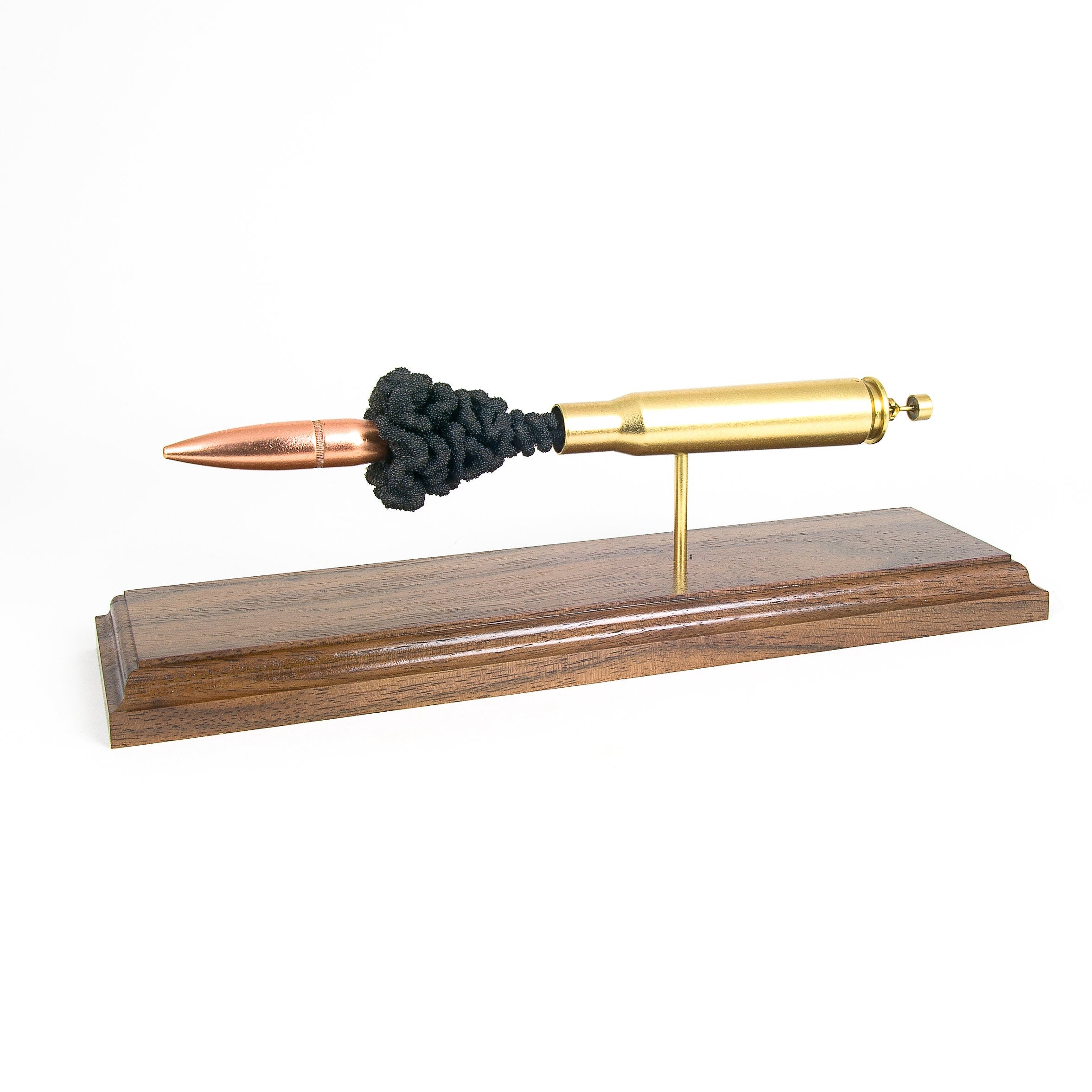 Sectioned 50 BMG cartridge showing primer case powder and projectile aligned horizontally