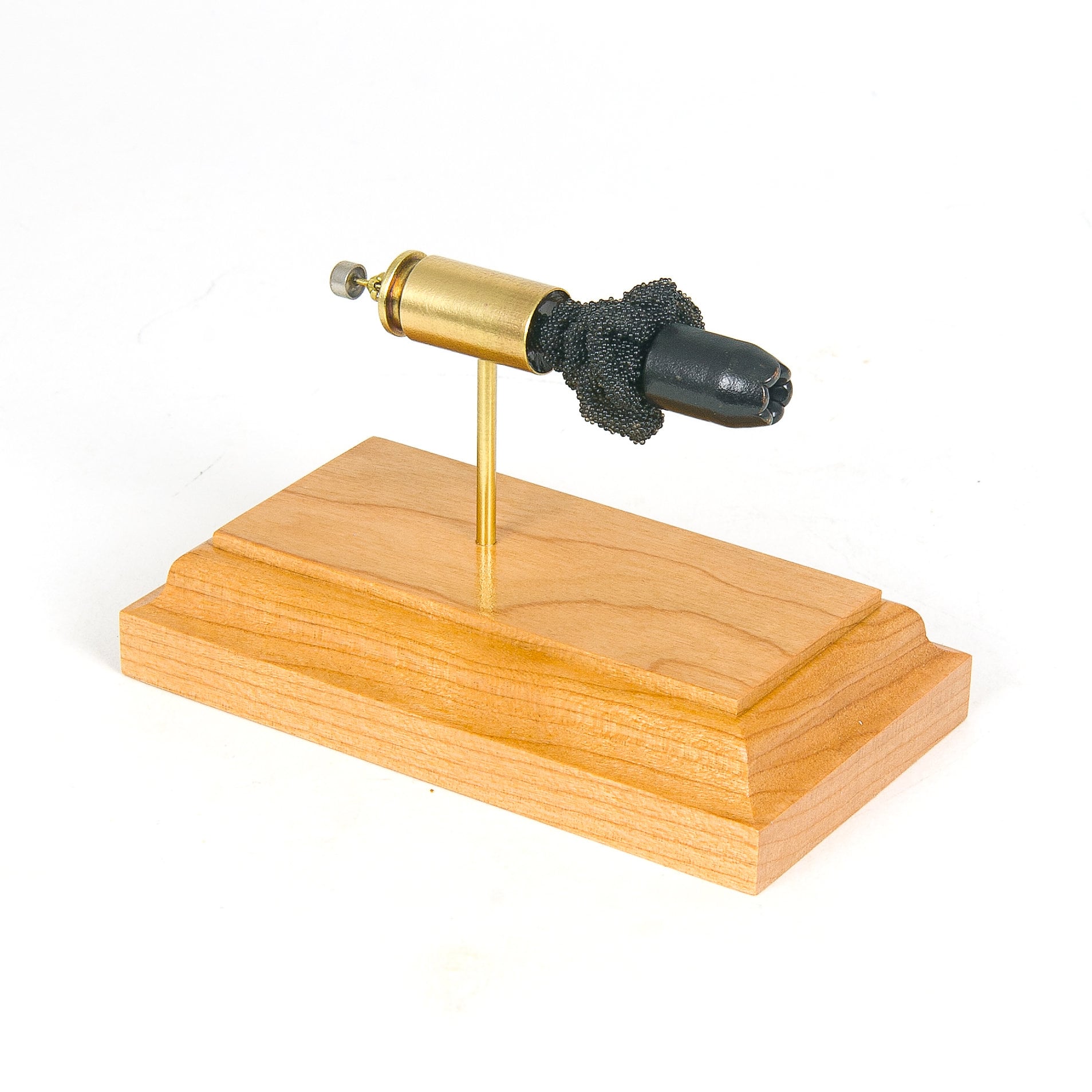 Expanded 40 S&W Winchester Ranger SXT 180gr Black Talon cartridge display on hardwood base