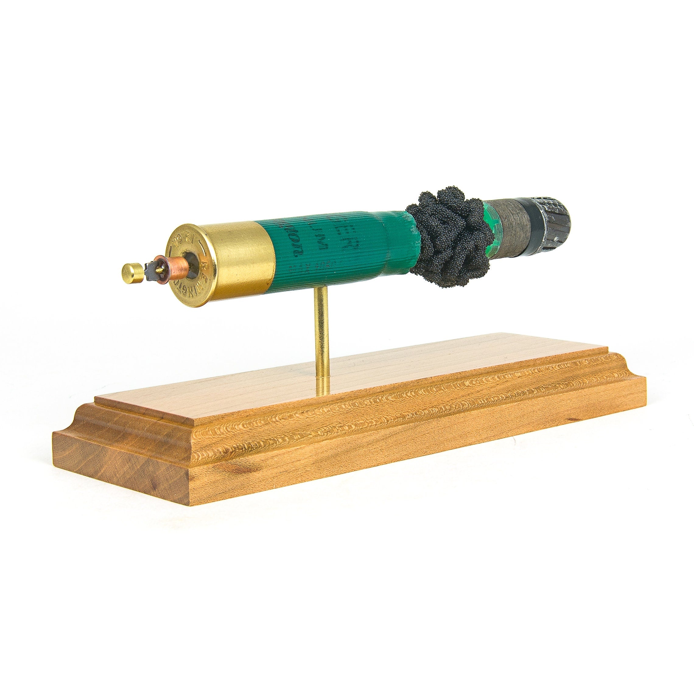 expanded 12ga shotshell showing primer wad and slug