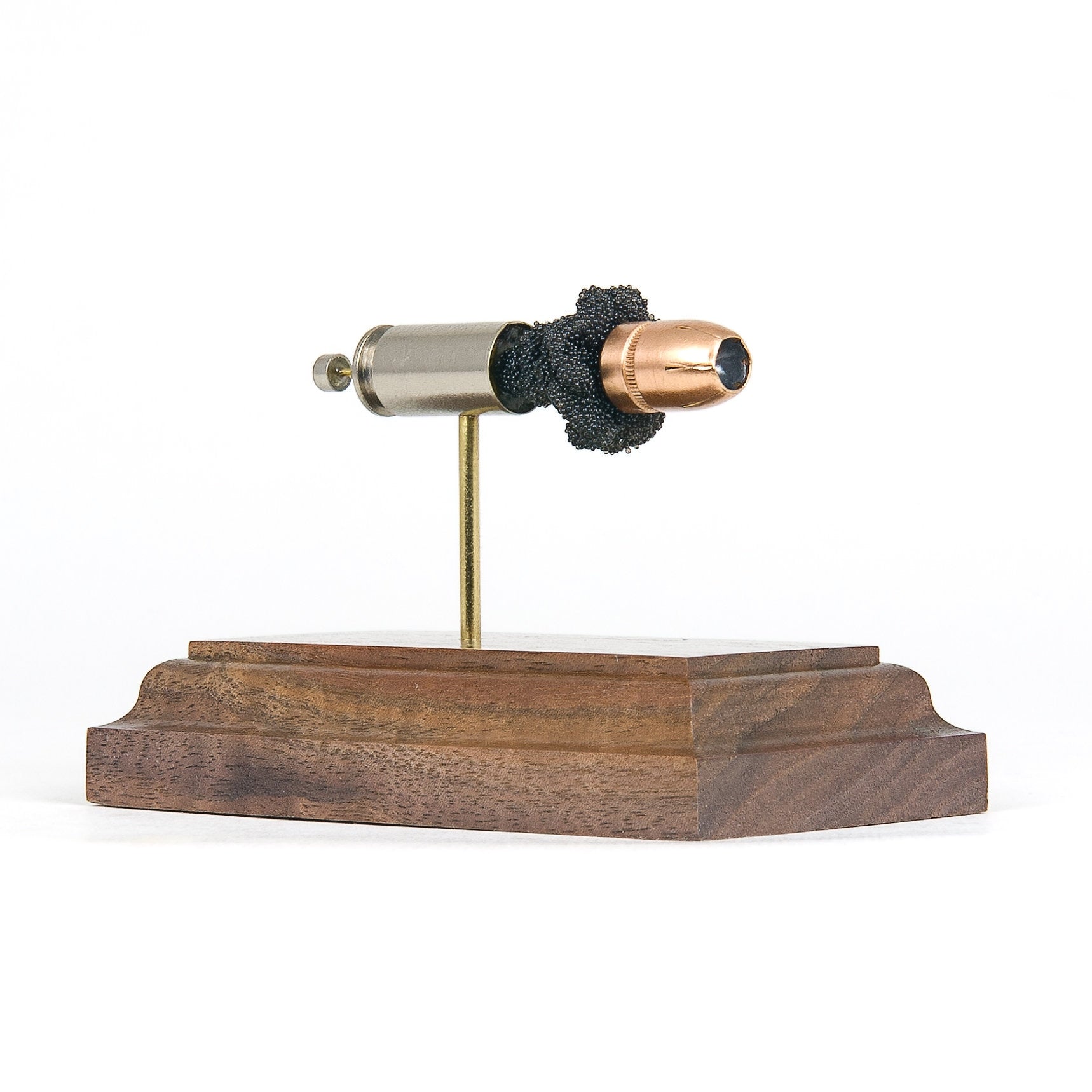 Expanded 40 S&W Federal HST 180gr JHP cartridge display on hardwood base