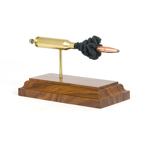 Expanded 243 Win Hornady InterLock cartridge display on rosewood base