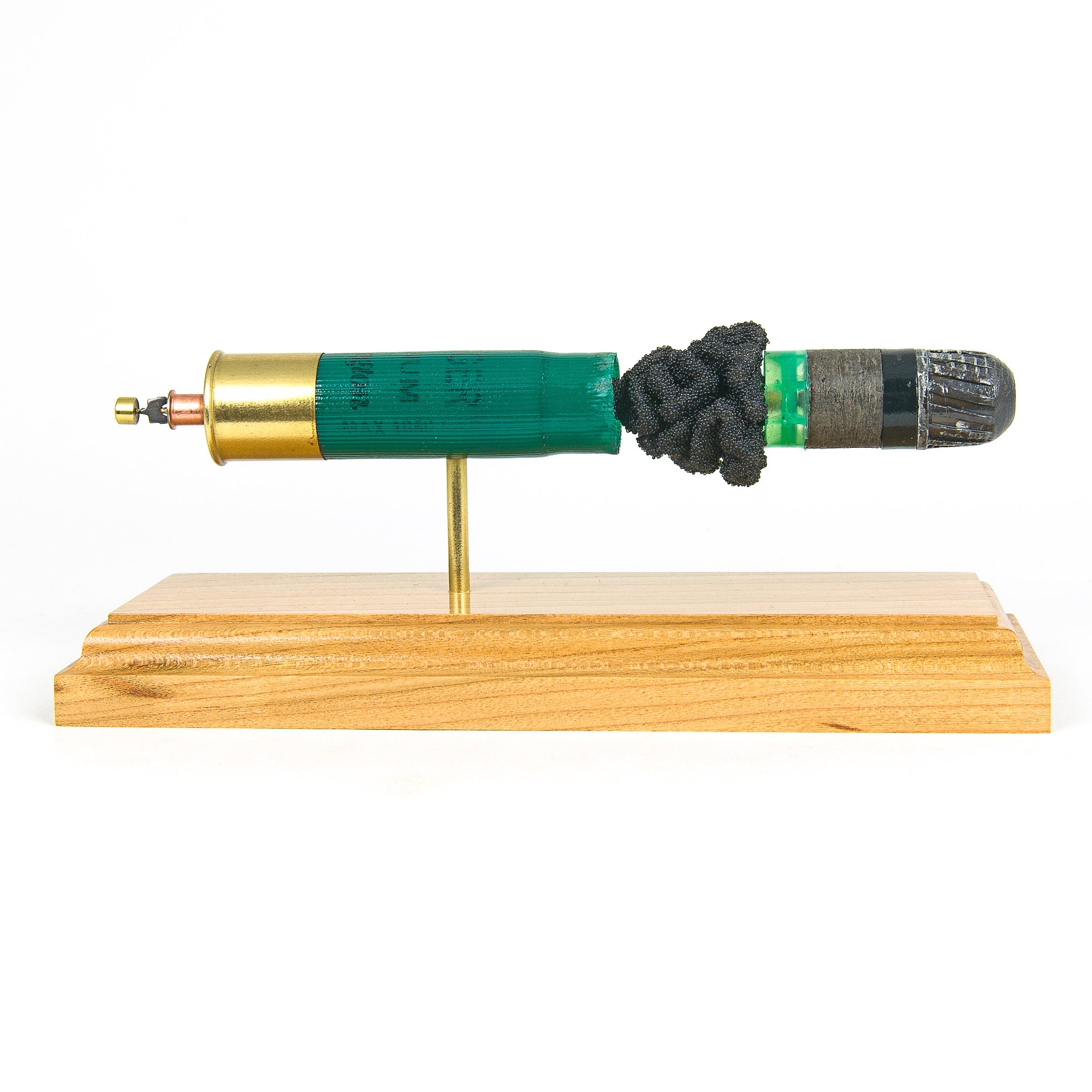 inert 12ga slug shotshell display on hardwood base