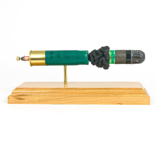 inert 12ga slug shotshell display on hardwood base