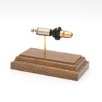 9mm Luger 124gr +P HST JHP Federal Premium expanded cartridge display on walnut base