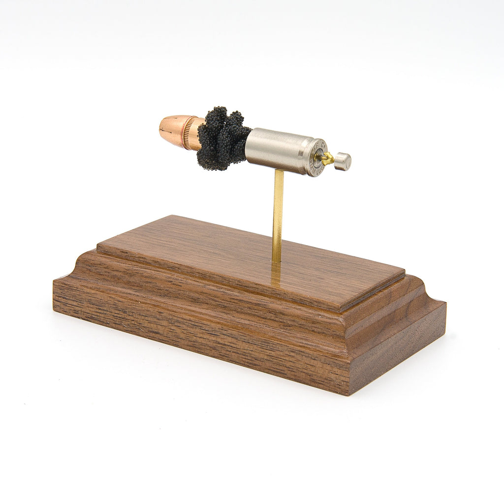 Inert 9mm Luger Federal Premium HST cartridge model hardwood base