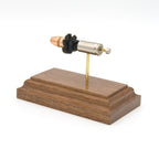 Inert 9mm Luger Federal Premium HST cartridge model hardwood base