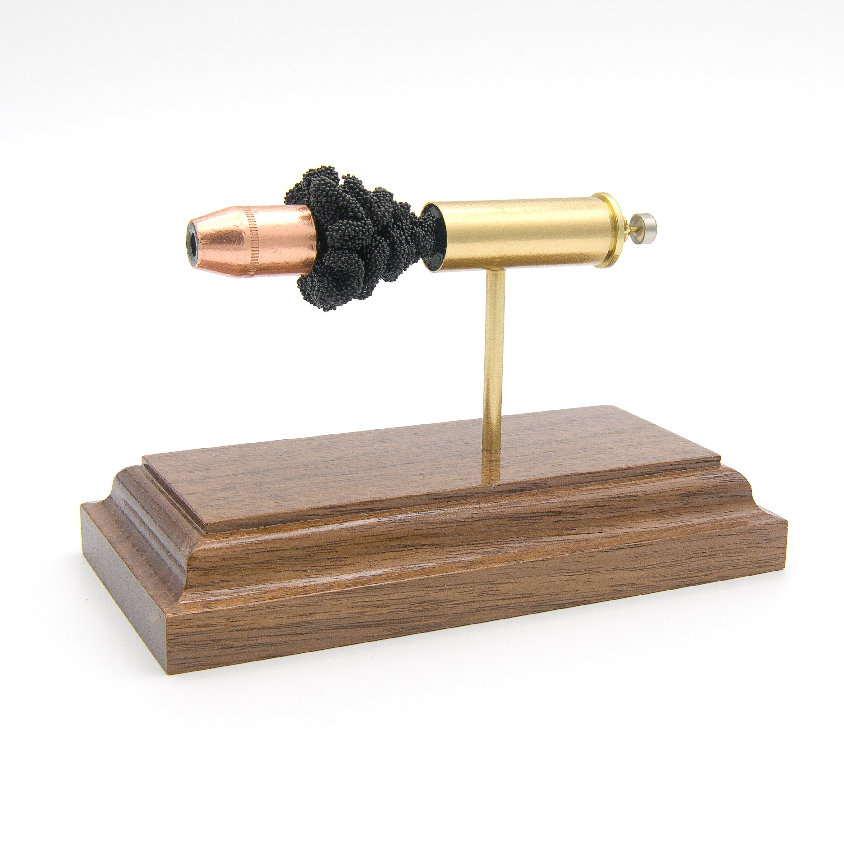 Sectioned 44 Magnum revolver cartridge showing internal components aligned horizontally