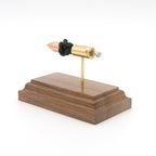 Handmade 9mm TUI cartridge display aligned on solid wood base