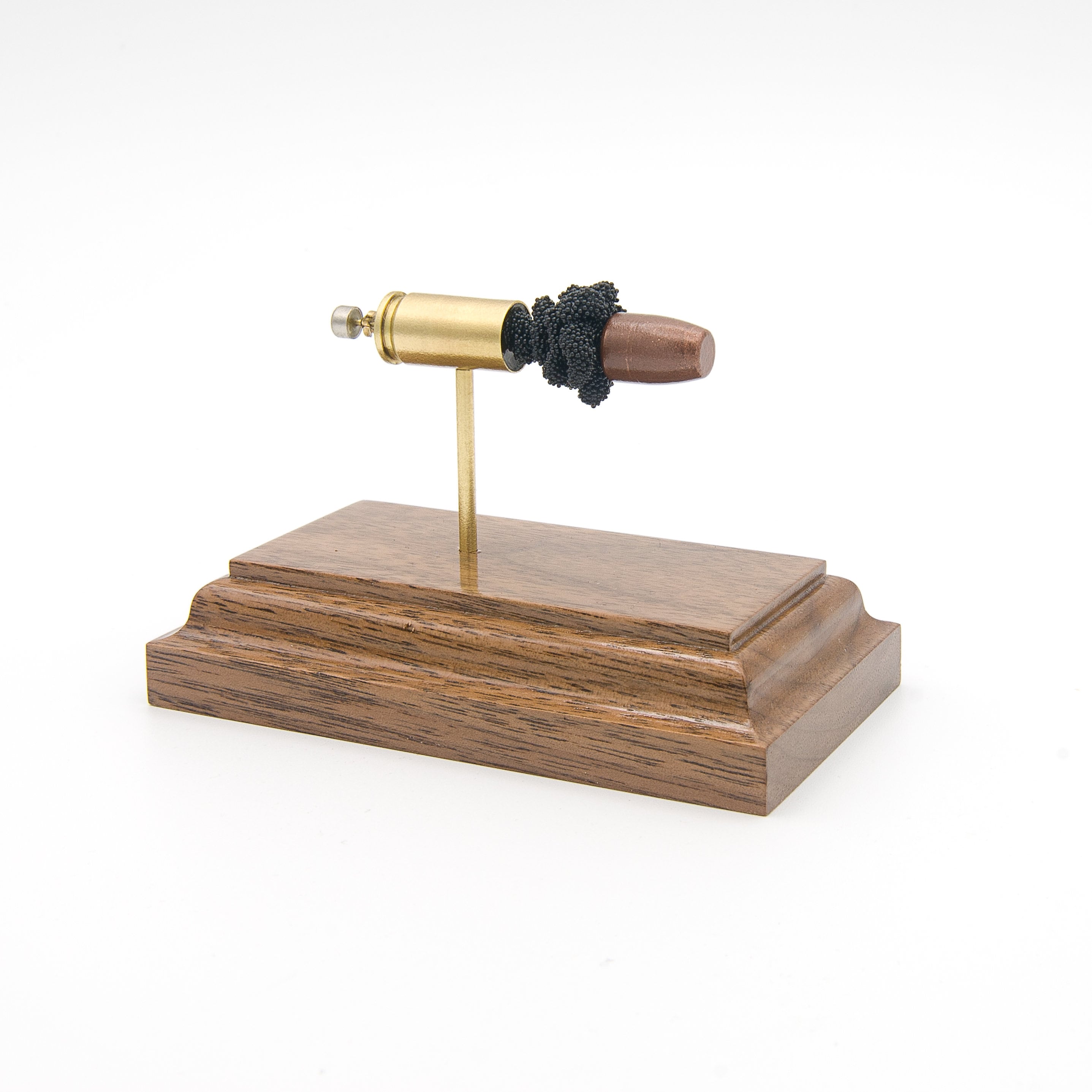 Expanded 9mm Luger Federal American Eagle 70gr frangible cartridge display on hardwood base