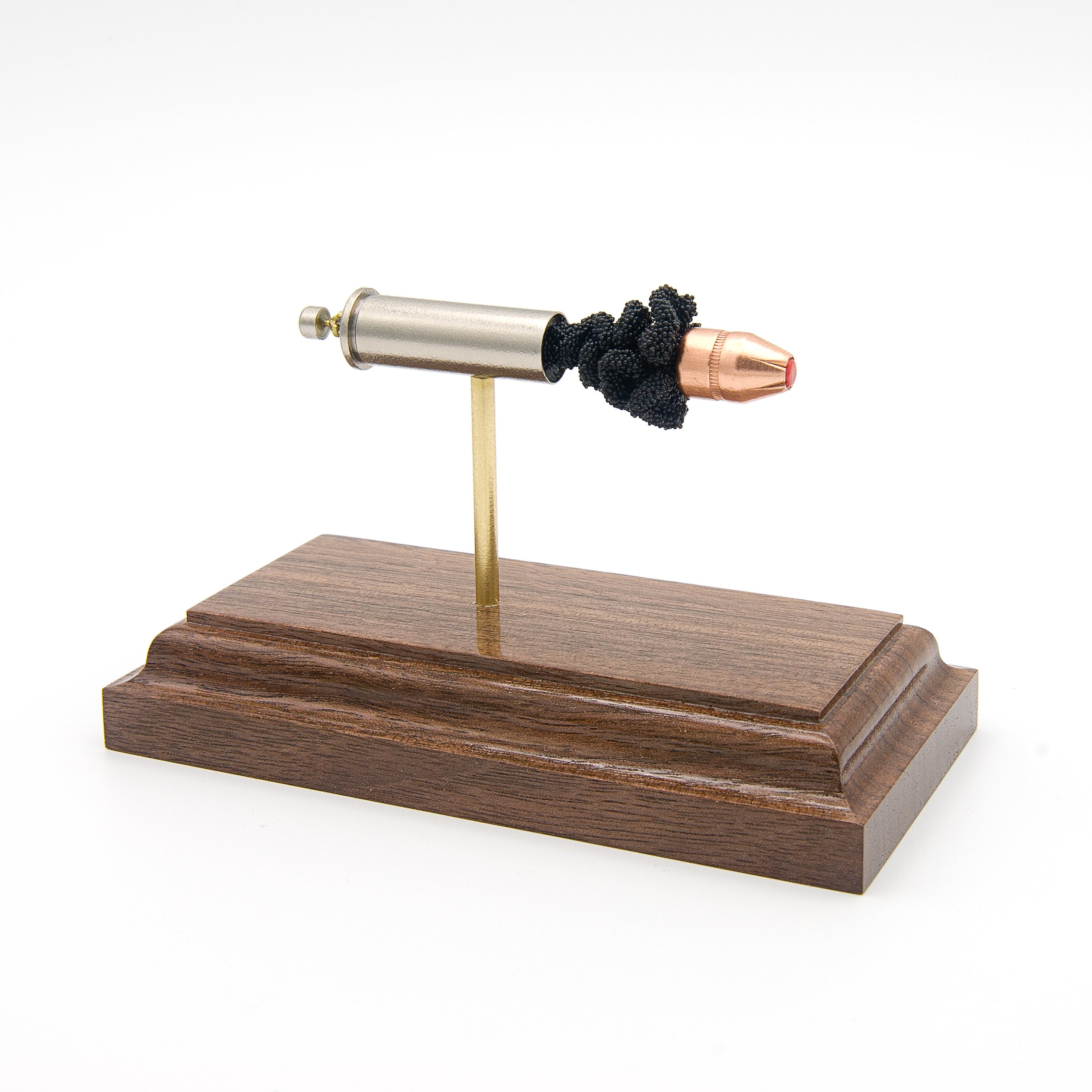 Expanded 38 Special Hornady 110gr FTX cartridge display on hardwood base