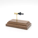 Expanded 22LR ELEY cartridge display on walnut wood base