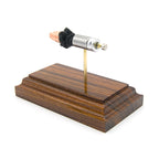 Inert 9mm Luger G9 solid copper EHP cartridge model hardwood base